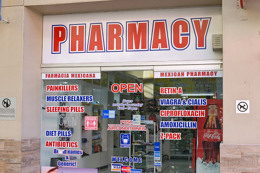 Cabo San Lucas. Mexico - 14 January 2024: Entrance to one of the resort's many pharmacies selling over the counter medicines to tourists.