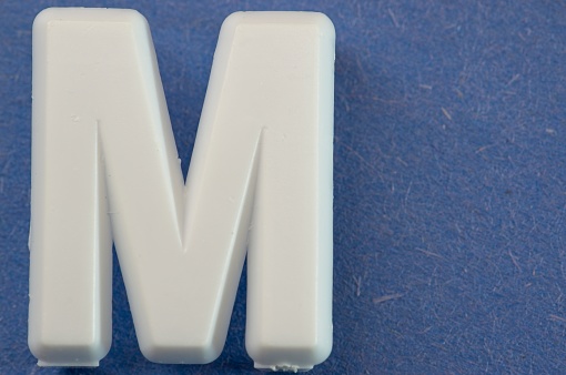 Letter M on a blue background