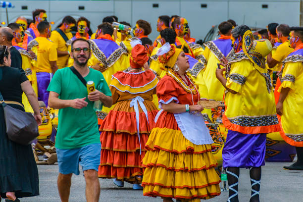 Montevideo, Uruguay -  February 9, 2024: Comparsa group at street waiting to calls parade carnival, montevideo, uruguay.