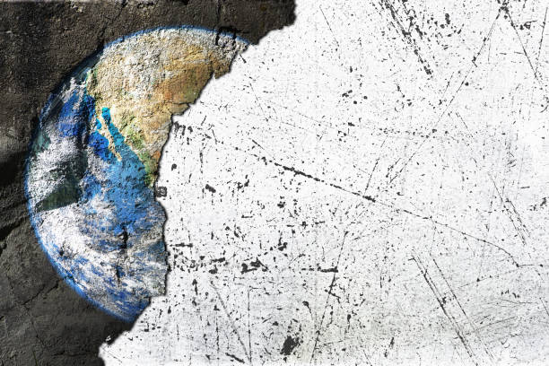 Satellite image of Planet Earth on rough, textured concrete wall, cut out with white copy space to the right