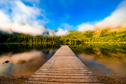 View of the surrounding landscape at Ödensee in Bad Mitterndorf in Styria. Nature at the clear swimming lake in the Salzkammergut in Austria.