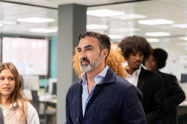 istock Man leading a team meeting in modern office. 2022568993