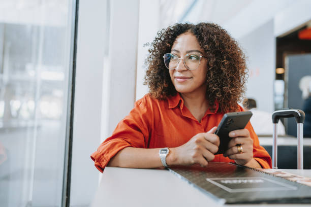 istock Woman in airport restaurant 2022569006