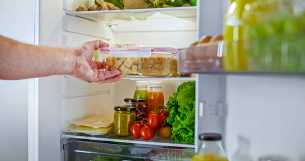 istock Man hands taking food out of refrigerator 2022571244