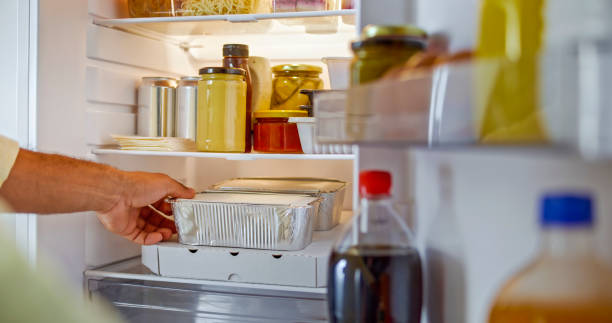 istock Man hands taking food out of refrigerator 2022571283