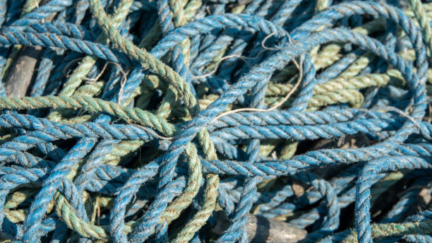 fishing nets and ropes on the quay of the port of urla izmir, turkey - turkish culture turkey fishing boat fishing foto e immagini stock