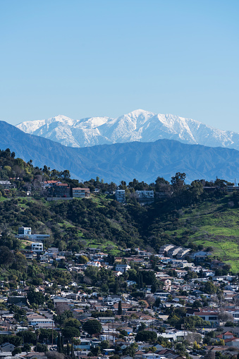 Los Angeles California Mt Washington hillside neighborhood with snowcapped Mt Baldy peak in the background.