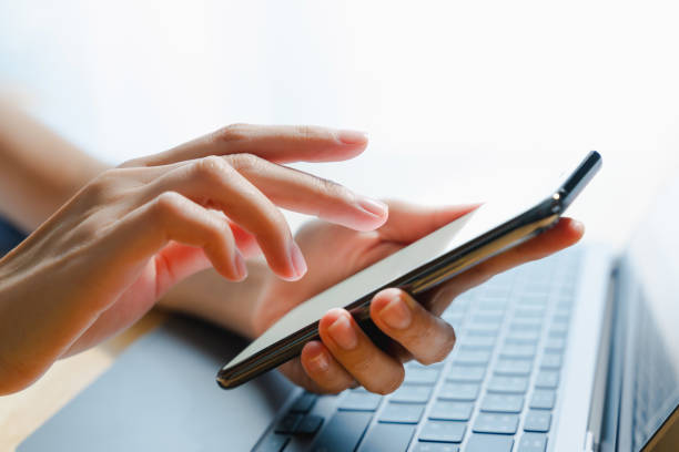 istock The business manager uses a smartphone and its apps for customer support, including email, chat, and phone communication. 2022614102