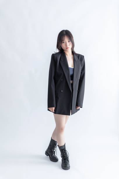 istock Asian woman in black suit and boots 2022617802
