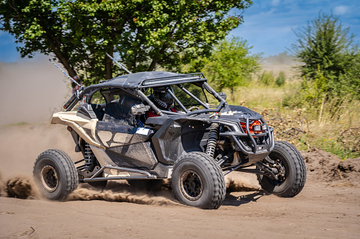 An off-road vehicle in a beautiful and savage desert landscapes north of Tabuk in Saudi Arabia