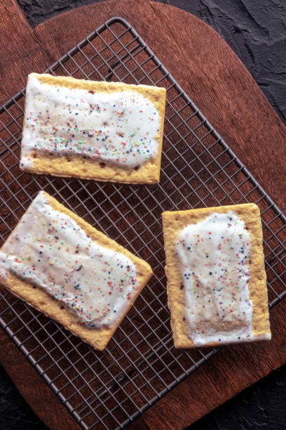 istock Pop tarts on a baking rack. Poptart toaster pastry, overhead flat lay shot 2022630354