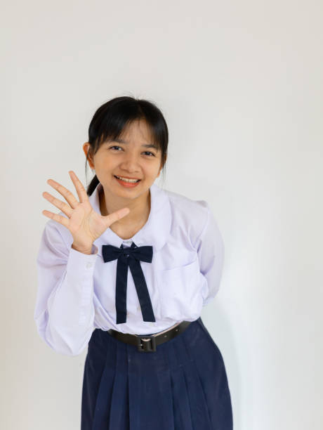 Happy student young girl on white background.