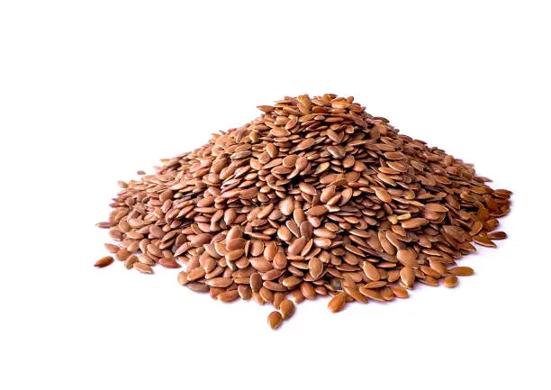 Heap of Organic Whole Brown Flax Seeds Isolated on White Background.