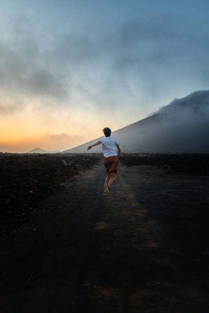 istock Girl jumping at sunset with a volcanic view, Lanzarote 2022650229