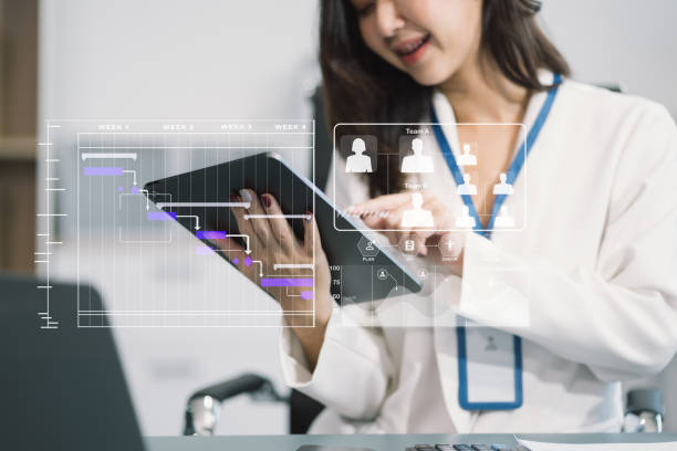 istock Business woman hand Project manager working and update tasks and Gantt chart scheduling virtual diagram.with smart phone, tablet and laptop in office. 2022663506