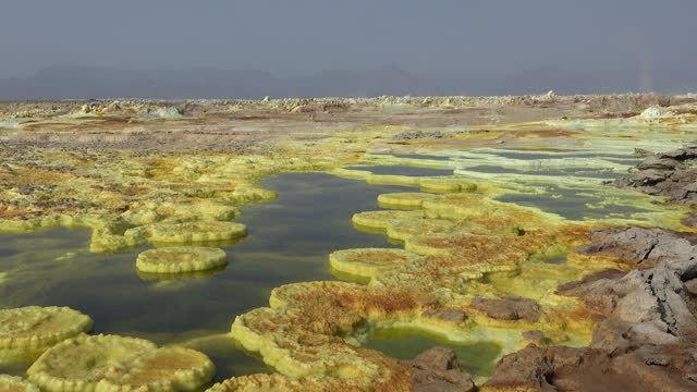 Hot springs and acid mineral in surreal landscape in Ethiopia, Africa
