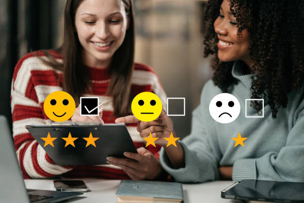 istock Woman holding a digital tablet with checkboxes rating smiley faces excellent for Satisfaction Survey, Happy Client Customer Experience concept. 2022663555