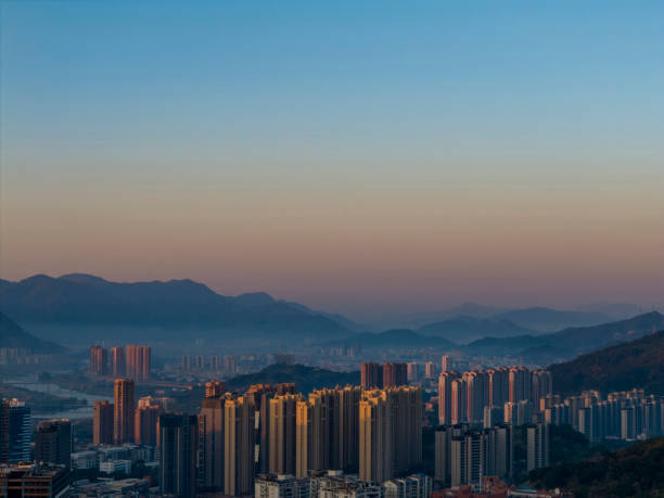 High angle images of sunlight shining on high-rise buildings in cities - Stocks