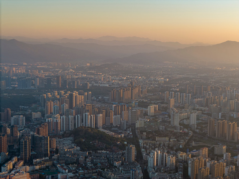 A bird's-eye view of the morning sunlight shining on urban buildings