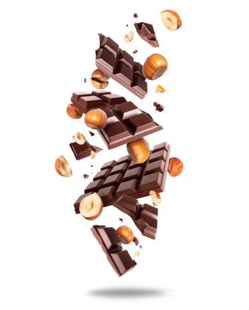 istock Broken dark chocolate bar with hazelnuts in the air isolated on a white background 2022674581