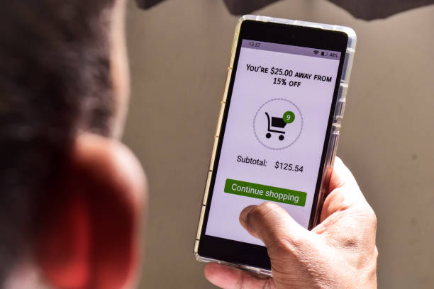 istock Upselling sales techniques in E-commerce concept to encourage customers to spend more money. Person using mobile applications to purchase items online. 2022712212