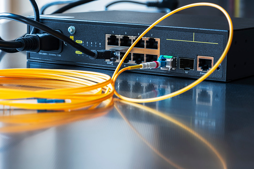 Network technologies. Switch with optical fiber cables.