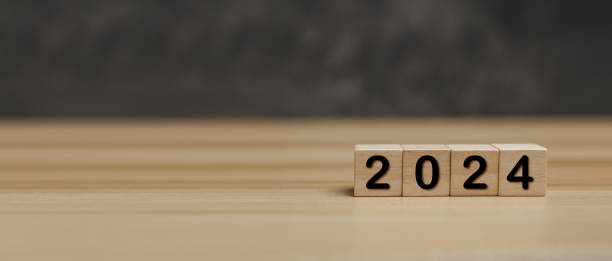 istock Happy New Year 2024. number written on wooden cube block stack on desk with copy space, 2024, strategy, investment, new business, new year congratulation, goal and target plan concept 2022723285