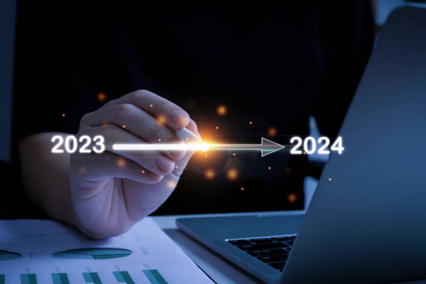 istock Goal. businessman hand using digital pen touching on loading progress from 2023 to 2024 with laptop computer, change from 2023 to 2024, strategy, investment, business planning, happy new year concept 2022727037