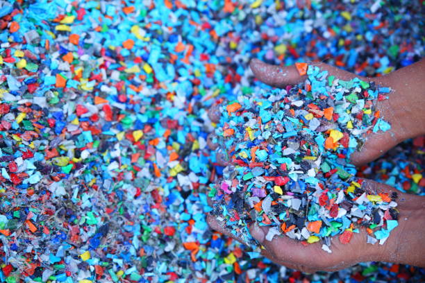 istock Plastic Resin pellets in holding hands. 2022742998