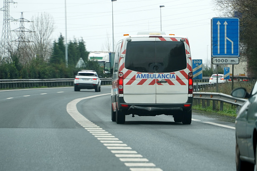 Ambulance driving on a highway in Spain
