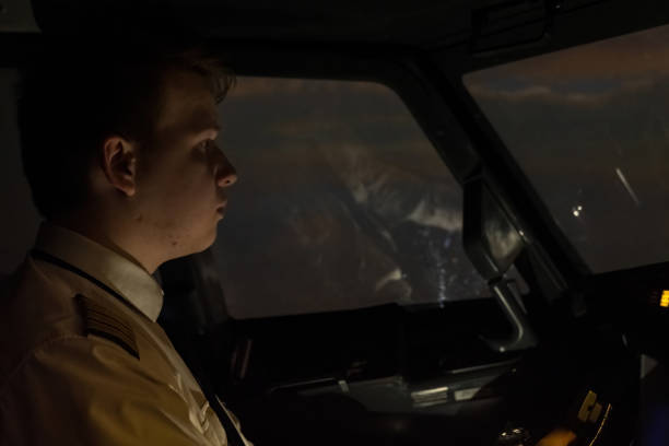 istock Captain with firm grip on controls during night flight 2022763093