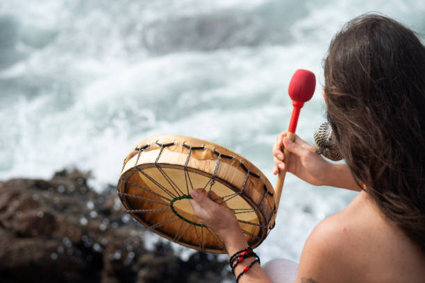 Salvador, Bahia, Brazil - February 02, 2024: People are seen playing percussion instruments during a party for Iemanja on Rio Vermelho beach in the city of Salvador, Bahia.