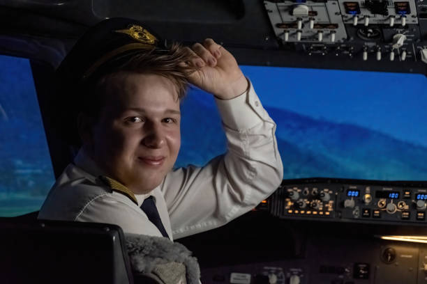 pilot adjusts hat and proceeds to engage autopilot feature - cockpit airplane autopilot dashboard imagens e fotografias de stock