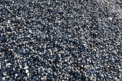 construction material close-up . Grey stones bunch for constuction work