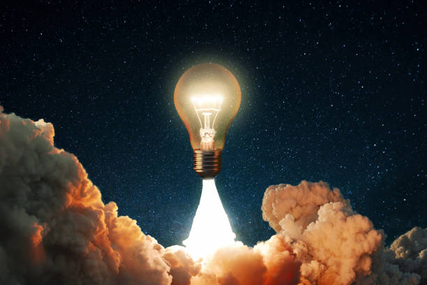 istock Creative rocket light bulb glows with smoke and blast successfully lift off into the starry sky space. Business start up launch and successful idea, concept. New idea and thoughts. Science 2022784786