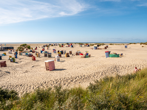 West beach with hooded beach chairs and tents on Borkum island, East Frisia, Lower Saxony, Germany