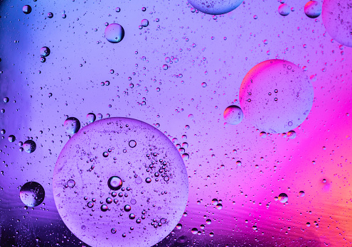 Oil bubbles in water, abstract  background.