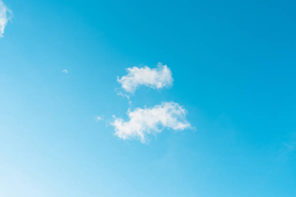 Nice cloudscape white fluffy clouds in the blue sky.Blue sky background with clouds