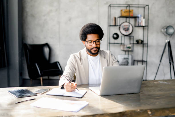 istock Brazilian professional is captured mid-thought at his desk 2022807456