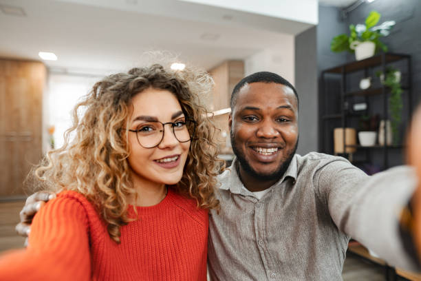 istock Happy young multiracial couple at home 2022810065