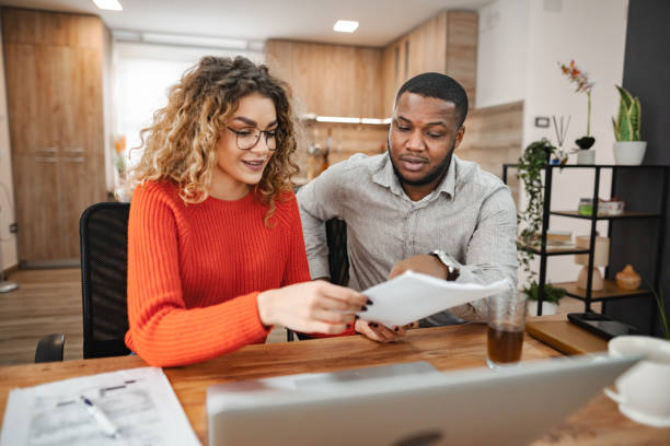 istock Multiracial couple planning their home finances together 2022811893