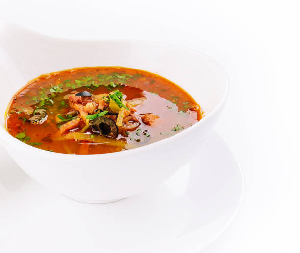 istock meat soup Solyanka in bowl isolated on white background 2022812414