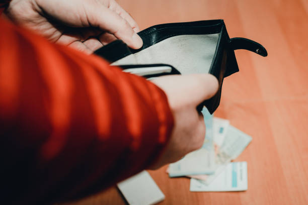 istock Mans hands checking wallet near desk.close up,toned.Blurred background.Soft focus. 2022812935