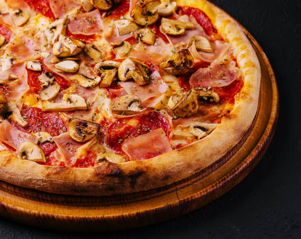 istock pizza with ham, salami and mushrooms 2022819136