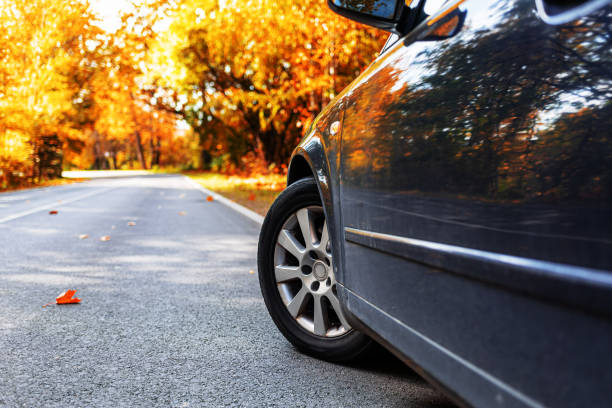 istock Car on asphalt road on autumn day at forest or park.Selective focus,copy space. 2022830527