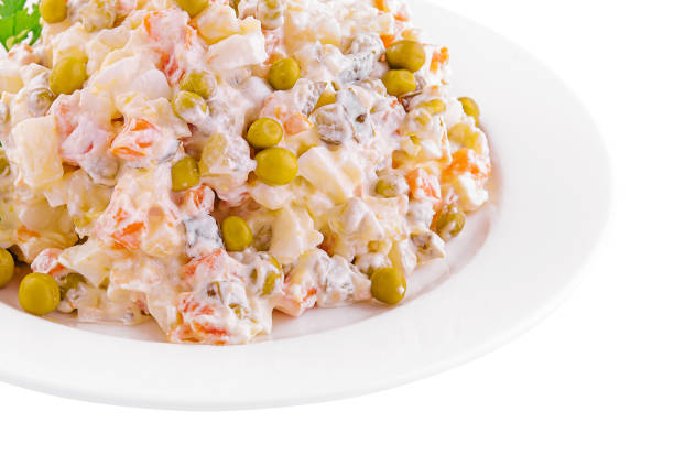 salad Olivier with mayonnaise on plate