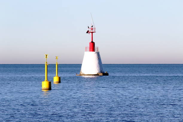 istock Serene blue waters with a buoy against the backdrop of a clear sky 2022840362