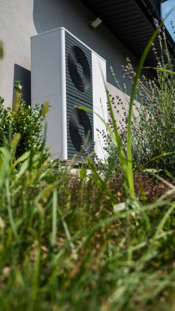 istock External heat pump unit against the wall of the house. Modern technologies for energy saving 2022840892