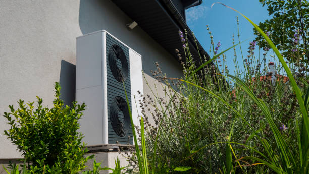 istock External heat pump unit against the wall of the house. Modern technologies for energy saving 2022841949