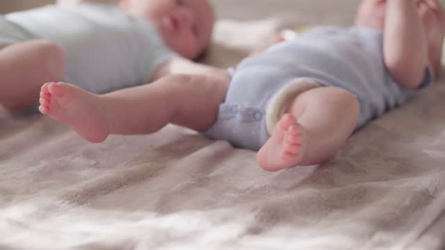 Small babies' legs and feet - stock video
